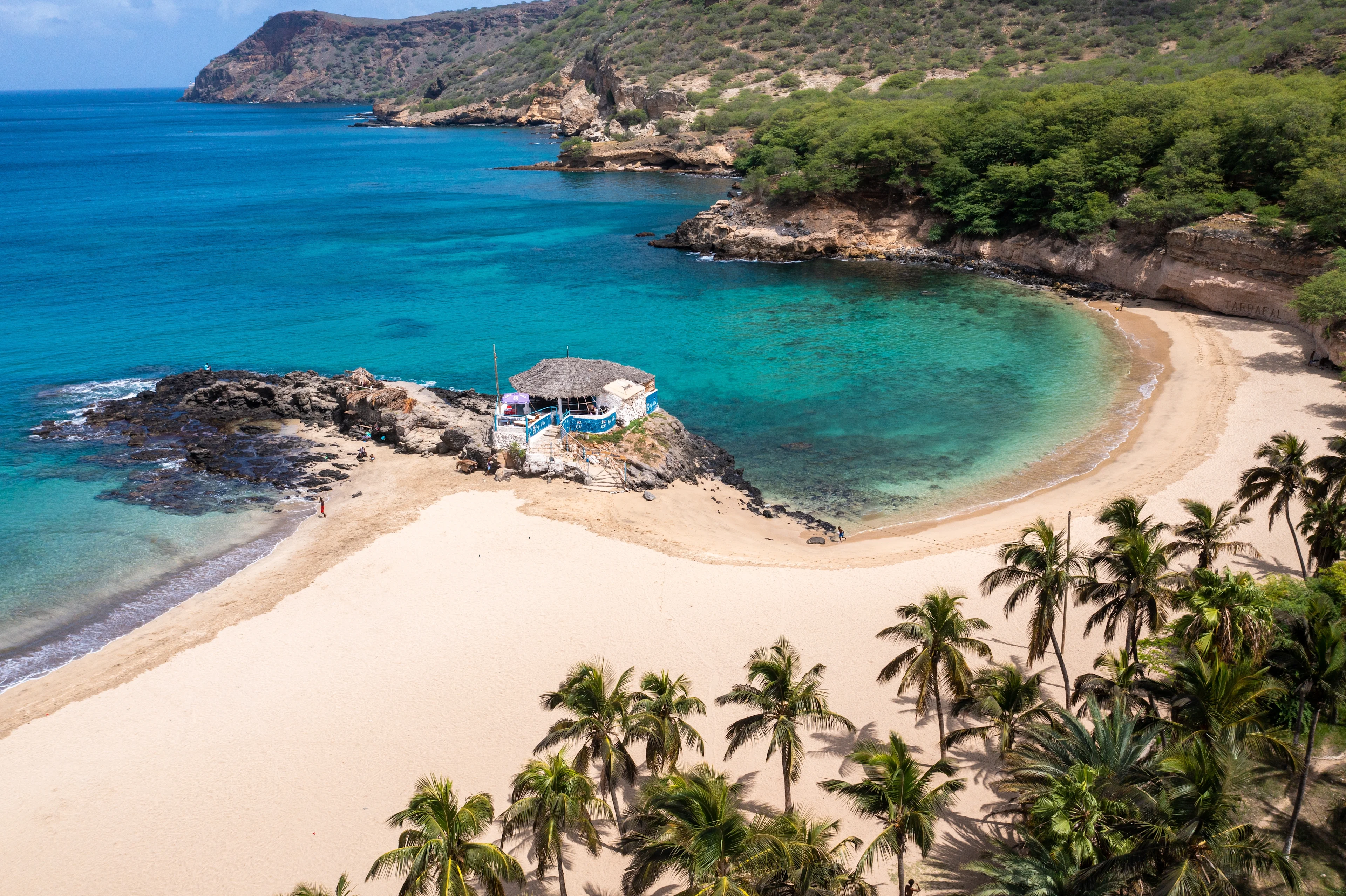 A scenic coastal view of Cape Verde featuring turquoise waters, sandy beaches and volcanic landscapes. The image supports Dragonpass's article exploring why Cape Verde is emerging as one of the fastest-growing holiday destinations following the country's World Cup success.