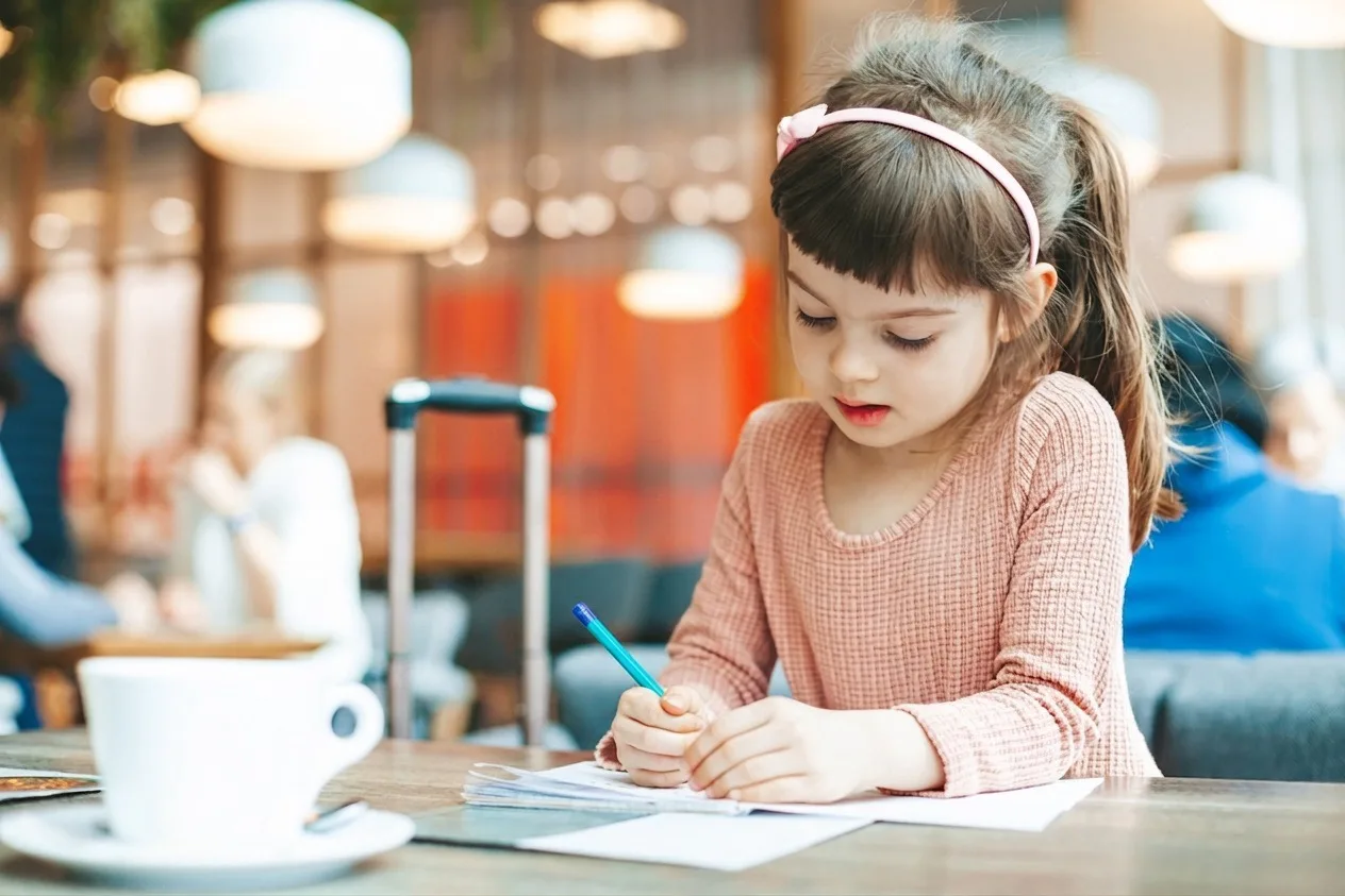Child in lounge colouring